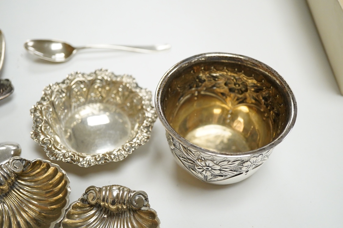A collection of small silver, to include a late Victorian seven bar toast rack, by Edward Gilbert, London, 1887, length 13.3cm, a late Victorian bowl, pair of shell salts, nut dish, egg cup, Georgian chamberstick(part of